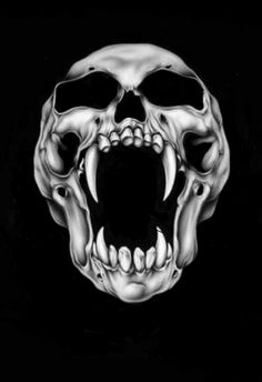 a black and white photo of a skull with its mouth open