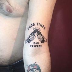 a man with a tattoo on his arm saying good times, bad friends