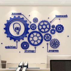 a wall mounted with gears and words on it