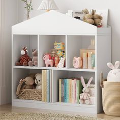 a white book shelf filled with books and stuffed animals