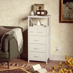 a living room scene with focus on the chair and book shelf that is leaning against the wall