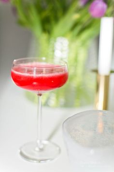 a close up of a wine glass on a table