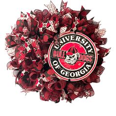 the university of georgia wreath is made out of red and white ribbon, with an image of a bulldog's head on it