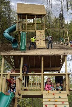 children playing on a wooden play structure in the woods with slide, climbing wall and slides