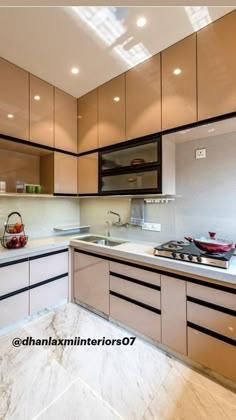 a kitchen with marble counter tops and cabinets