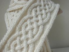 a white knitted scarf on top of a mannequin