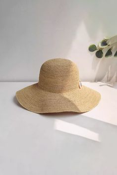 Chic Sun Protection for Stylish Escapes Enhance your summer look with our hand-woven straw sun hat, accented with natural seashells. This chic hat features a wide brim for ample sun protection and versatile styling with a flexible wire. Perfect for beach vacations and summer getaways. Style #: WWAJ518 Lightweight Coastal Straw Hat For Beach Season, Lightweight Coastal Style Beach Hat, Lightweight Coastal Hat For Vacation, Lightweight Beachy Panama Hat For Beach, Beige Beachy Straw Hat For Beach, Natural Woven Wide Brim Bucket Hat, Wide Brim Woven Bucket Hat In Natural, Natural Wide Brim Toquilla Straw Bucket Hat, Wide Brim Natural Woven Bucket Hat