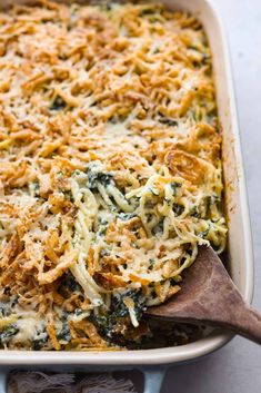 a casserole dish filled with spinach and cheese