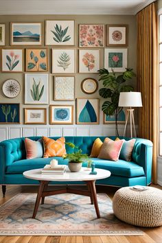 a living room filled with lots of pictures on the wall above a blue couch and coffee table