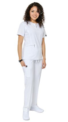 Be ready to impress the second you put on Dress A Med's Soft Stretch Silver Zipper scrub set. This 2 piece uniform scrubs set is ultra-flattering with its accent silver zipper neckline. You'll be sure to show off your figure while still maintaining your trusted and professional image. This uniform soft stretch scrubs set is made to be dazzling as you are with its accentuating double stitch lines. The scrub top is modern yet ultra-useful with a zipper compartment and 2 large pockets. The straight Nurses Dress Uniform Style, Nurse Uniform Modern White, Nurses Uniform Modern, Nurse Dress, Nurse Dress Uniform, Scrubs Nursing Uniforms, White Scrubs, Medical Scrubs Outfit, White Flamingo