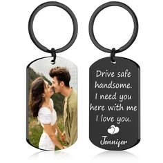 two key chains with an image of a man and woman kissing on the forehead, one has