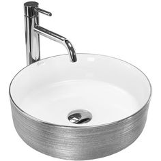 a round white sink with chrome faucet