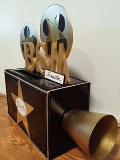 an object made out of metal and wood with the word bsm on it's side