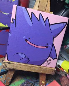 a painting of a purple cat with pink cheeks