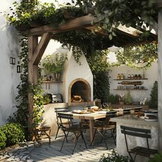 an outdoor dining area with table, chairs and pizza oven in the back ground surrounded by greenery