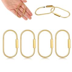 four pieces of gold colored metal with two hands and one hand holding an open loop