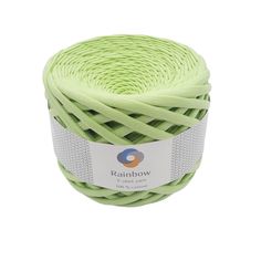 a ball of neon green yarn with white trim on the top and bottom, sitting in front of a white background