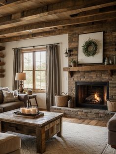 a living room filled with furniture and a fire place in front of a large window