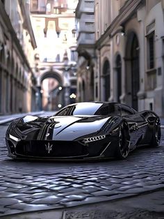 a black sports car is parked on the street in front of some buildings and cobblestone