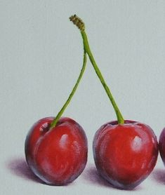 three cherries sitting on top of each other