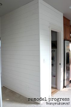 an empty kitchen and living room in a house that is being built into the wall