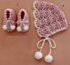 a crocheted hat and booties are shown next to a pair of baby shoes