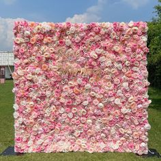 a large flowered wall in the middle of a field