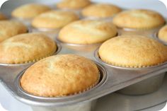 several muffins in a metal pan on top of a stove