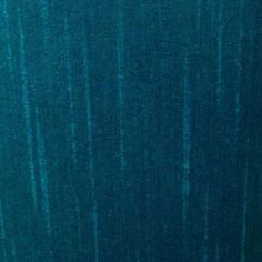 a close up view of a blue curtain with vertical lines on the bottom and sides