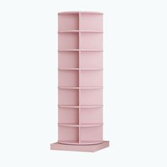 a tall pink shelf with many shelves on it's sides and one section open