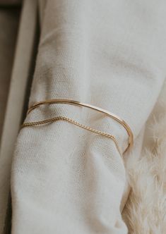 We attached one of our favorite chains to our classic hammered cuff for a 2-in-1 stack and we're obsessed with the outcome. Wire is hand shaped and lightly hammered for texture. Stevie Chain is attached to give a layered cuff and chain look. Available in 14kt Gold Fill + Sterling Silver. Shop our complete Cuff Collection. Handmade in Eau Claire, WI. Our jewelry is handmade so each piece will be unique and may vary slightly from what is pictured. Eau Claire Wisconsin, Twist Earrings, Copper Uses, Everyday Wear Jewelry, Handmade Jewelry Designs, Circle Studs, Hand Shapes, Silver Shop, Herkimer Diamond