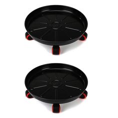 two black trays with red handles on each side