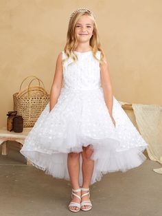 The Haylee Girls Special Occasion Dress exudes elegance with its 3D floral, beaded, and sequined overlay that adorns the bodice and skirt. Its high-low skirt is trimmed with horse hair for a dramatic flair, and the rear zipper and sash tie ensure a perfect fit. This dress is a charming choice for any girl looking to shine at a formal event. Whether attending a wedding, a formal party, or any special event, the Haylee Girls Special Occasion Dress is sure to turn heads and leave a lasting impressi Girls Communion Dresses, Girls Ball Gown, Preteen Fashion, Girls Special Occasion Dresses, Hair Trim, Girls Pageant Dresses, Christening Dress, High Low Skirt, Communion Dresses