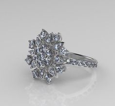 a white gold diamond cluster ring