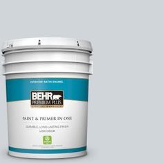 the behr paint and primer in one is shown on a gray background with white trim