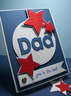 a father's day card with the word dad written in blue and red stars