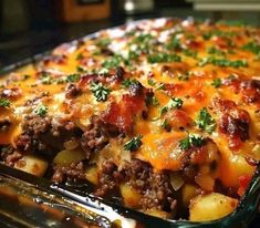 a casserole dish with meat, potatoes and cheese