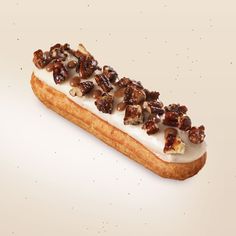 a piece of bread topped with nuts and icing