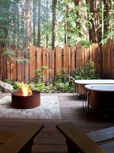 a fire pit in the middle of a wooden deck