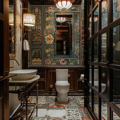 a bathroom with a toilet, sink and large mirror in it's center wall