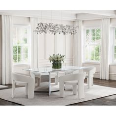 a dining room table with chairs and a chandelier