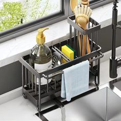 a kitchen sink with soap, toothbrushes and other bathroom items in the holder