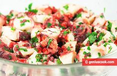 a close up of a salad in a glass bowl