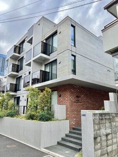 an apartment building with stairs leading up to it