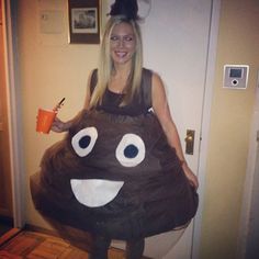 a woman is dressed up as a poop with a drink in her hand and smiling