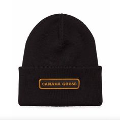 Canada Goose Rib-Knit Beanie Hat. Fold-Over Cuff With Logo Patch. Merino Wool. Made In Italy. Classic Black Knitted Hat, Classic Black Wool Beanie, Classic Black Beanie For Fall, Black Wool Hats For Cold Weather, Black Wool Beanie For Fall, Black Wool Beanie Cap, Canada Goose Logo, Knitted Wool Beanie, Canada Goose Women