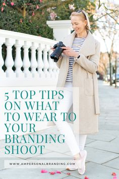 a woman holding a camera and looking at it with the words top tips on what to wear to your branding shoot