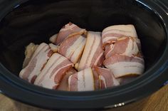 several pieces of meat in a crock pot ready to be put into the slow cooker