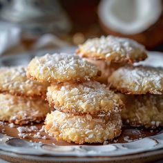 some sugar covered donuts are on a plate