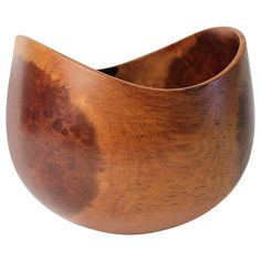 a wooden bowl is shown against a white background